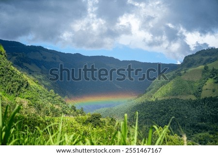 landscape coffee with clouds and rainbow