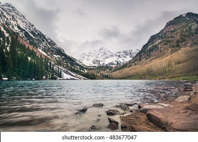 Landscape of Colorado at Maroon Bells. Beautiful image of mountains, lake, and picnic area. Happy travel concept. Outdoor recreation. Roadtrip destination.