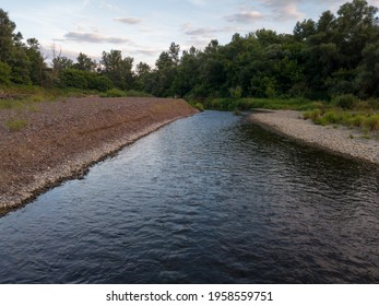 Landscape With Creek, Gravel Banks And Riparian Zone During Summer