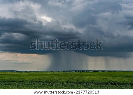 landscape with dark sky with rain clouds before storm. thunderstorm front