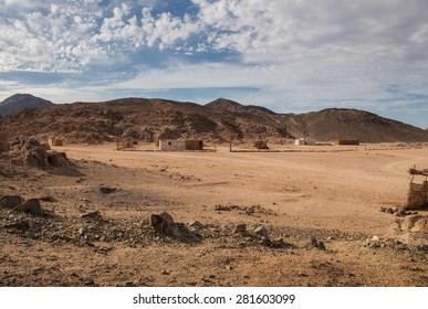 Landscape In The Desert In Egypt. Rocky Hills. Blue Sky With Many White Clouds.