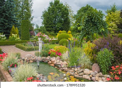 Landscape Design Of A Garden Plot: A Hot Summer Day, Plants At Home In The Sun, Beautiful Summer Garden Design