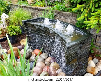 Landscape Design Ideas with Bubbling Water Feature  - Shutterstock ID 1106776637