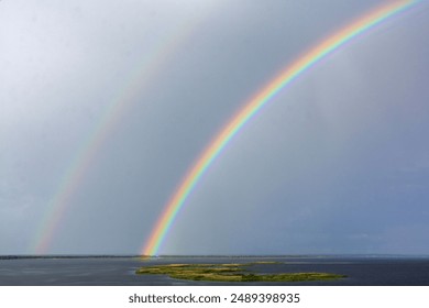 Landscape. Double rainbow over the river - Powered by Shutterstock