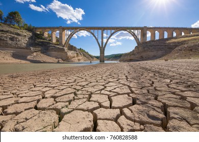 Landscape Of Dry Earth Ground And Viaduct, Extreme Drought In Entrepenas Reservoir, In Guadalajara, Castilla, Spain Europe