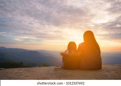 Landscape Family Mother And Daughter Or Asian Children Looking Sunset Or Morning Sunrise On Peak Of Mountain With Warm Sunlight Sky And Cloud On Vacation Travel And Holiday Relax With Cold Weather