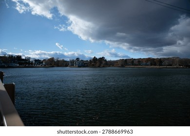 Landscape featuring a dramatic sky ove the Kennebunk River Maine