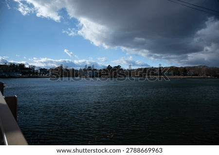 Landscape featuring a dramatic sky ove the Kennebunk River Maine