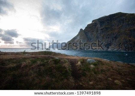 Similar – A big cloud hangs over a fjord