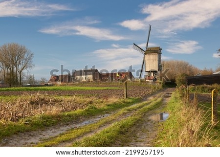 Landscape Flemish Ardennes with vintage windmill