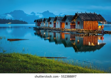 Landscape of floating accommodation the river with mountain background at midnight in Thailand