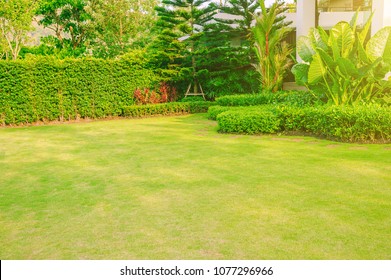 Landscape formal, front yard is beautifully designed garden , green  grass  with bush gardening. - Shutterstock ID 1077296966