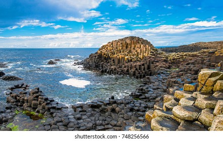 Landscape of Giant's Causeway trail with a blue sky in summer in Northern Ireland in United Kingdom. UNESCO heritage. - Shutterstock ID 748256566
