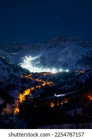 Landscape of glowing road from Medeu ice skate to Shymbulak ski resort at Tian Shan mountains at night time in Almaty city, Kazakhstan - Shutterstock ID 2254787157