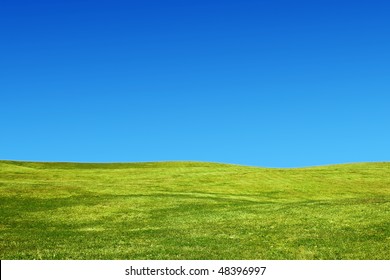 Landscape With Grassy Hills And A Clear Sky