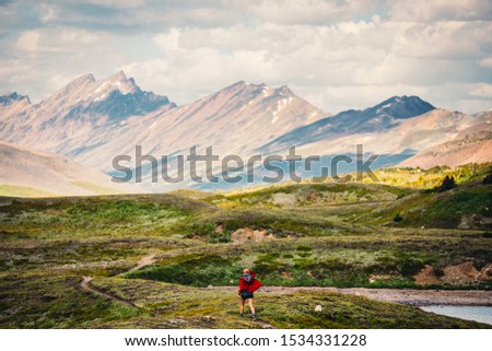 Landscape of The Great Divide Trail in the Rocky Mountains. Alberta, Canada. Hikers seen in the distance. Stunning Landscapes.