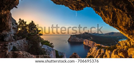 Landscape of the gulf of capo caccia from the Cave of broken vessels at sunset