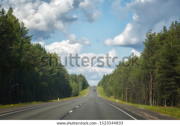 Landscape with\
highway and forest on a summer\
day