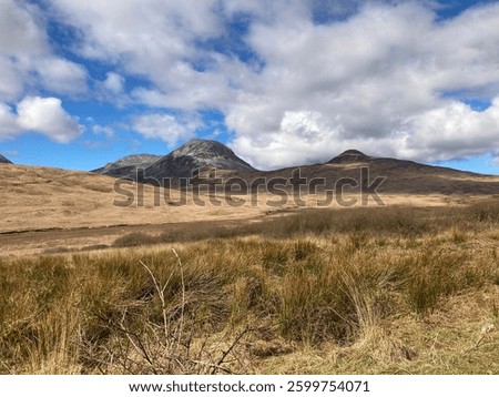 Landscape of hills on Jura⁩, ⁨Isle Of Jura⁩, ⁨Scotland⁩, ⁨United Kingdom⁩, with clouds casting shadows over the grassland
