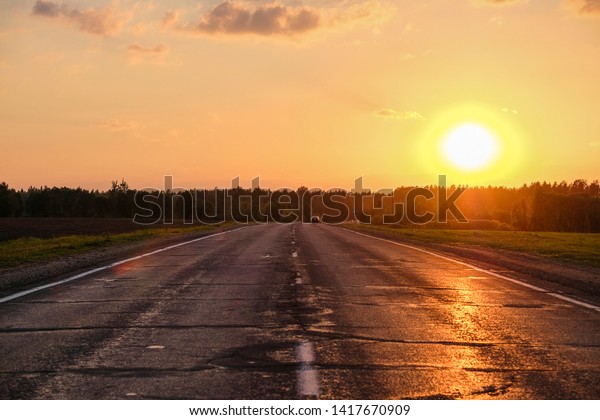 Landscape with\
the Image of a Country Road at\
sunset