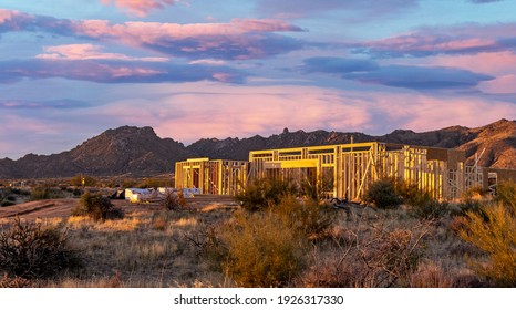 Landscape Image Of A New Custom Home Being Built And Framed In North Scottsdale With Mountains In Background In The Morning. 