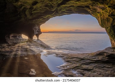 Landscape of the interior of a sea cave with sunbeams, Paradise Point, Lake Superior, Michigan’s Upper Peninsula, USA