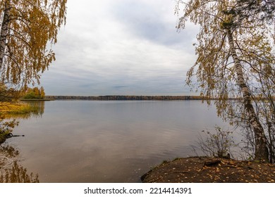 Landscape With The Lake, Horizon Line, Trees And Branches In Autumn