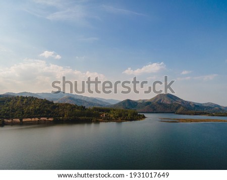 Landscape of lake and range of the mountain that show pine forest at Huay Tha Khoei reservoir, Ratchaburi