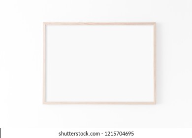 Landscape large 50x70, 20x28, a3,a4, Wooden frame mockup on white wall. Poster mockup. Clean, modern, minimal frame. Empty fra.me Indoor interior, show text or product - Shutterstock ID 1215704695