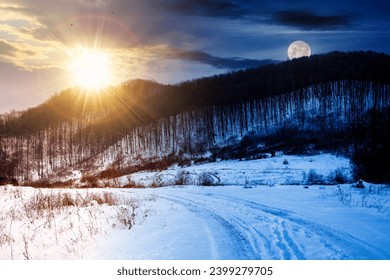 landscape with leafless forest on a snow covered hill beneath a sky with sun and moon. winter solstice day and night time change concept - Powered by Shutterstock