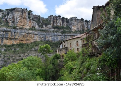 Landscape of limestone cliffs and mountains with a forest.