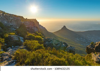 Landscape Of Lions Head Mountain Peak And Cape Town Skyline At Sunset Along A Hiking Pole Path Inside The Table Mountain National Park, Cape Town, South Africa.