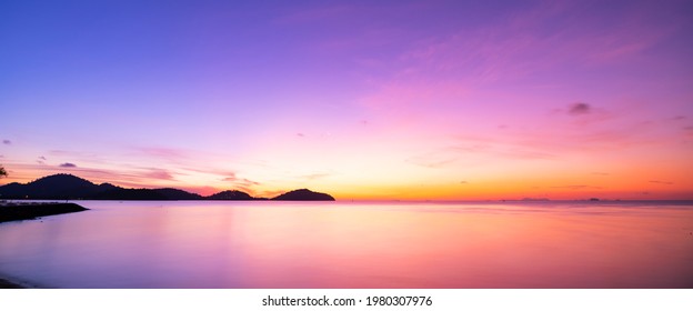 Landscape Long exposure of majestic clouds in the sky sunset or sunrise over sea with reflection in the tropical sea Beautiful cloudscape scenery Amazing light of nature Landscape.. - Powered by Shutterstock