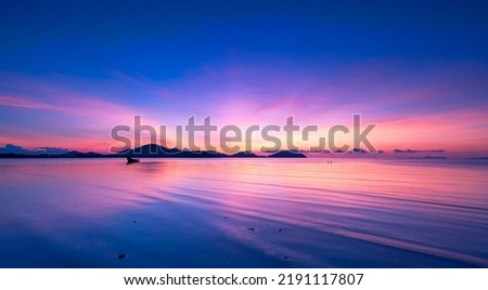 Landscape Long exposure of majestic clouds in the sky sunset or sunrise over sea with reflection in the tropical sea.Beautiful cloudscape scenery.Amazing light of nature Landscape nature background