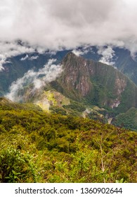 Landscape Of Machu Picchu, Climbing Machu Picchu Mountain. Huaina Picchu Mountain At The Back And Detail Of The Forest