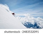 Landscape with male skier skiing down steep mountainside, Alpe-d