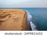 Landscape with Maspalomas town and golden sand dunes, Gran Canaria, Canary Islands, Spain. Natural Reserve of Dunes of Maspalomas, in Gran Canaria, Canary Islands, Spain.