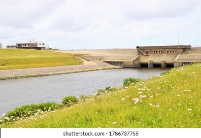 A Landscape With Meadow And Waterway