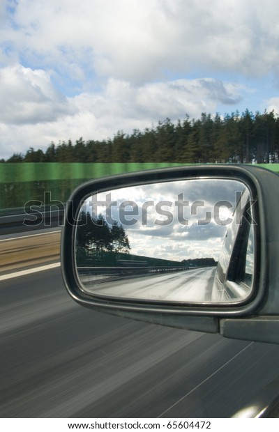 Landscape in the mirror of a
car