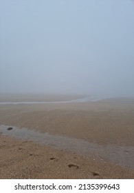 A Landscape Of A Misty Beach Sandy Beach