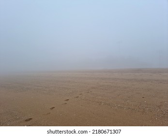 A Landscape Of A Misty Beach Sandy Beach