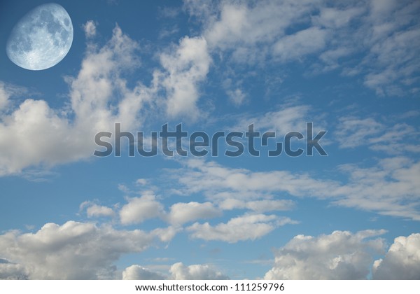 Landscape with the moon\
in the daytime sky