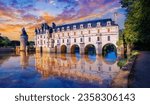 Landscape of the most beautiful Castle in the Loire Valley; Chenonceau reflected in the River Cher illuminated at sunset in Touraine region, France