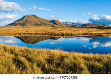 Landscape of Mount Guy reflected in the waters of Lake Clearwater on the South island of New Zealand; nature landscape of alpine mountain range at Ashburton Lakes, Hakatere conservation area 