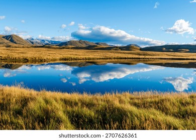 Landscape of Mount Guy reflected in the waters of Lake Clearwater on the South island of New Zealand; nature landscape of alpine mountain range at Ashburton Lakes, Hakatere conservation area