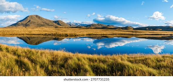 Landscape of Mount Guy reflected in the waters of Lake Clearwater on the South island of New Zealand; nature landscape of alpine mountain range at Ashburton Lakes, Hakatere conservation area