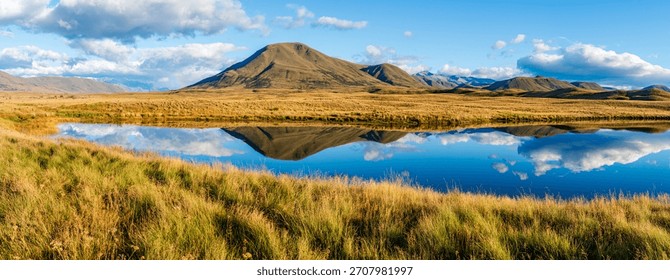 Landscape of Mount Guy reflected in the waters of Lake Clearwater on the South island of New Zealand; nature landscape of alpine mountain range at Ashburton Lakes, Hakatere conservation area