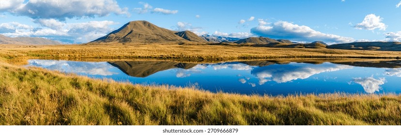 Landscape of Mount Guy reflected in the waters of Lake Clearwater on the South island of New Zealand; nature landscape of alpine mountain range at Ashburton Lakes, Hakatere conservation area