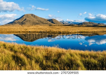 Landscape of Mount Guy reflected in the waters of Lake Clearwater on the South island of New Zealand; nature landscape of alpine mountain range at Ashburton Lakes, Hakatere conservation area 