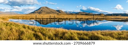 Landscape of Mount Guy reflected in the waters of Lake Clearwater on the South island of New Zealand; nature landscape of alpine mountain range at Ashburton Lakes, Hakatere conservation area